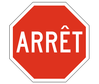Red octagon with white border and the word 'arret' in white lettering in the middle.