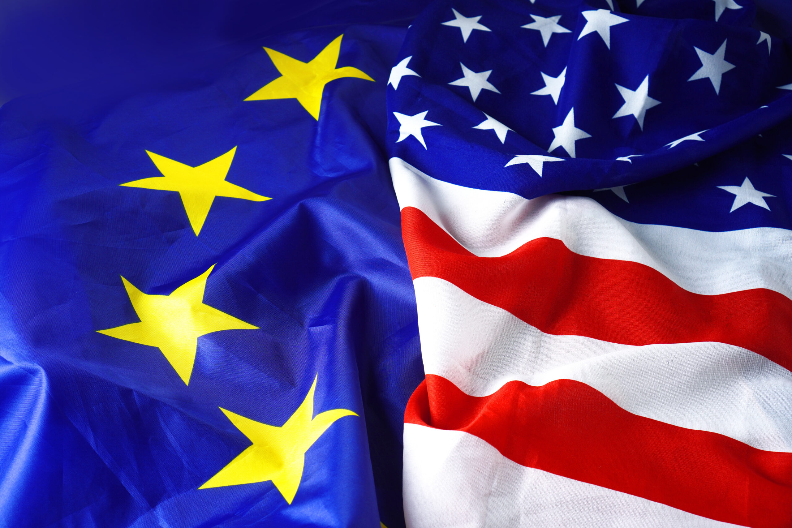 Flags of the European Union and the United States overlap.